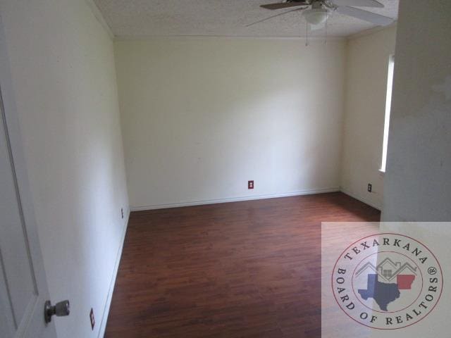 spare room with ceiling fan, hardwood / wood-style floors, and a textured ceiling