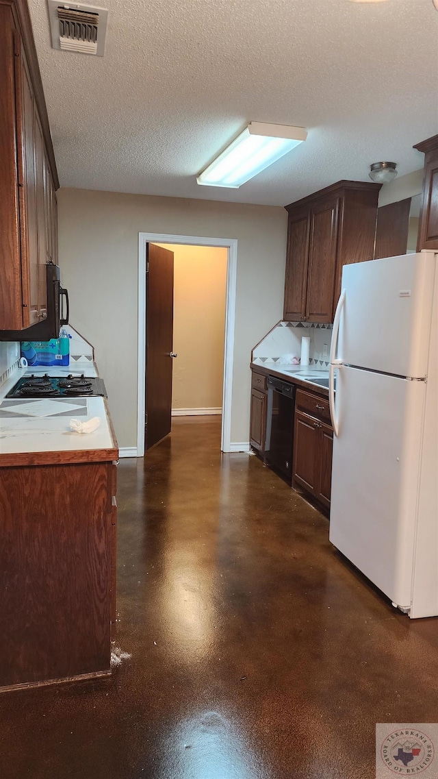 kitchen with dishwasher, a textured ceiling, range, and white refrigerator