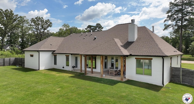 8203 Teal Rd, Texarkana, TX 75503 - back of house with a chimney, roof with shingles, a patio area, and brick siding