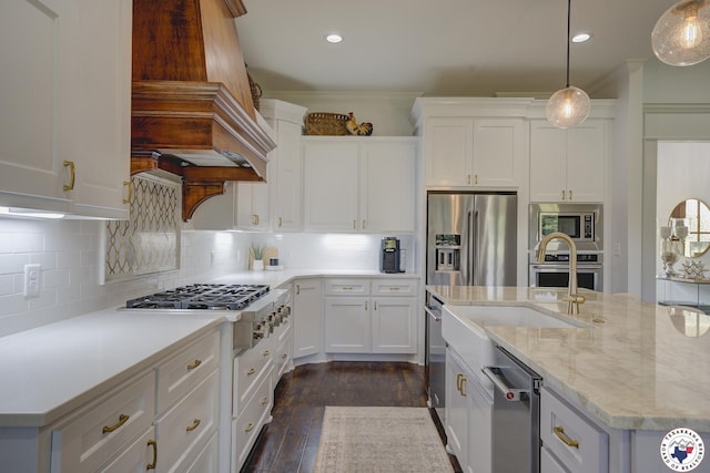 8203 Teal Rd, Texarkana, TX 75503 - kitchen featuring stainless steel appliances, custom range hood, white cabinets, decorative backsplash, and recessed lighting