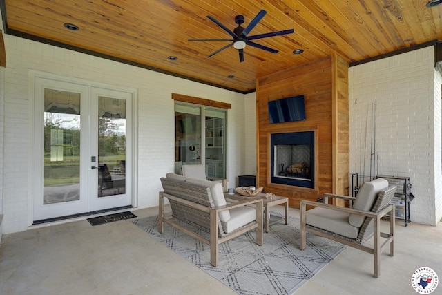 8203 Teal Rd, Texarkana, TX 75503 - view of patio / terrace featuring exterior fireplace, french doors, and a ceiling fan