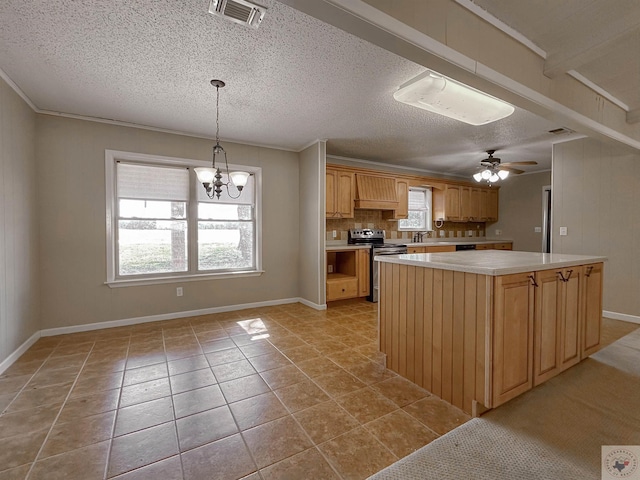 kitchen featuring custom range hood, decorative light fixtures, stainless steel range with electric cooktop, ceiling fan with notable chandelier, and a kitchen island