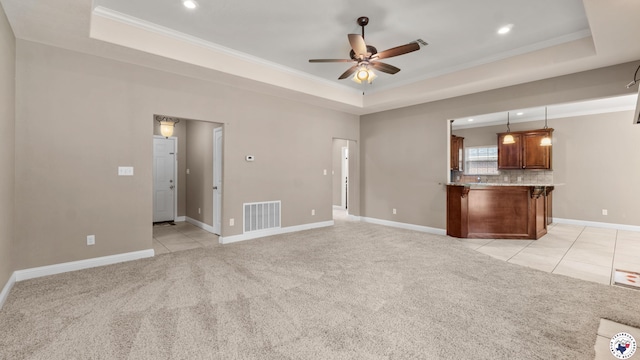 5005 Hidden Acres Dr, Texarkana, TX 75503 - unfurnished living room with a tray ceiling, a ceiling fan, ornamental molding, recessed lighting, and light colored carpet