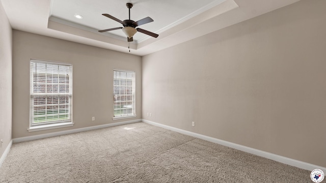 5005 Hidden Acres Dr, Texarkana, TX 75503 - carpeted spare room featuring a tray ceiling, a ceiling fan, and ornamental molding