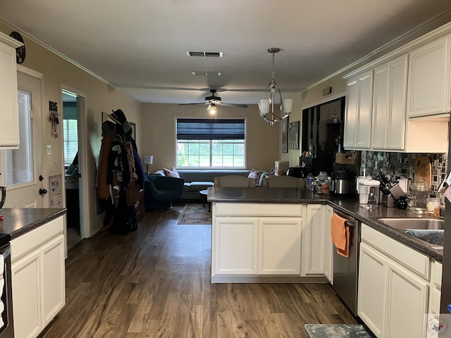 kitchen featuring tasteful backsplash, hanging light fixtures, stainless steel dishwasher, kitchen peninsula, and dark wood-type flooring