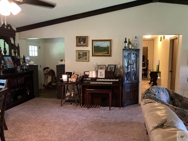 misc room featuring light carpet, vaulted ceiling with beams, and ornamental molding