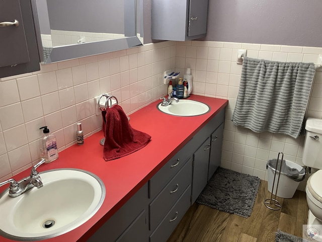 bathroom featuring hardwood / wood-style floors, toilet, and vanity