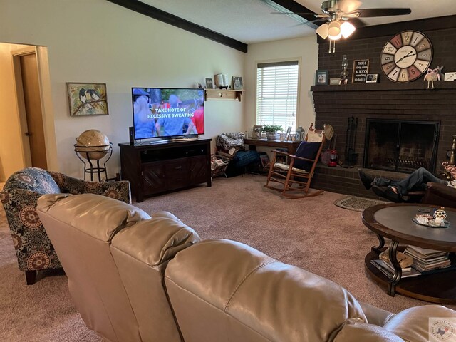 carpeted living room with crown molding, vaulted ceiling, a fireplace, and ceiling fan