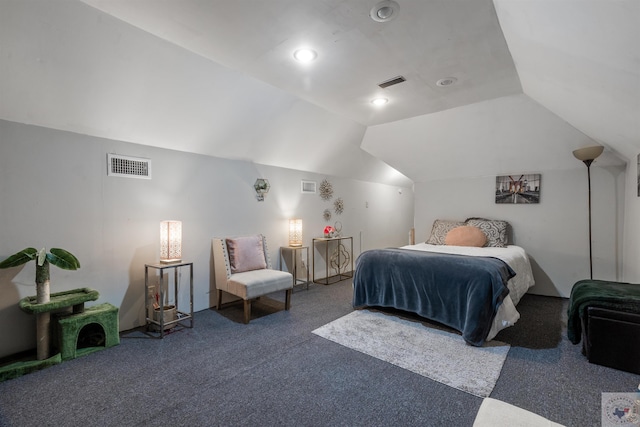 carpeted bedroom with lofted ceiling