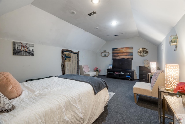 carpeted bedroom with lofted ceiling