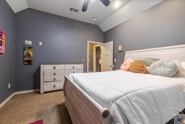 carpeted bedroom featuring ceiling fan and vaulted ceiling