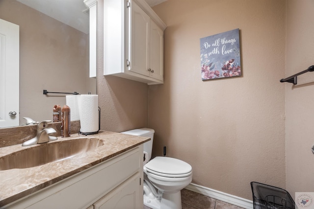 bathroom featuring vanity, toilet, and tile patterned flooring