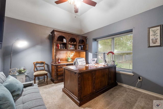 office with vaulted ceiling, ceiling fan, and light carpet