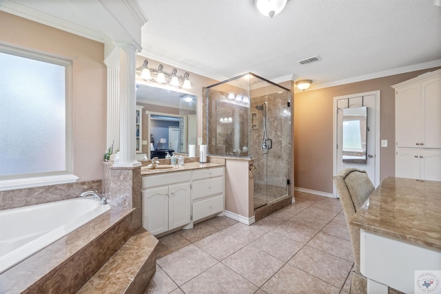 bathroom featuring tile patterned flooring, vanity, ornate columns, crown molding, and independent shower and bath