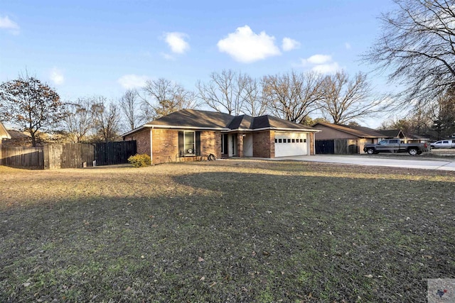 ranch-style house with a garage and a front lawn