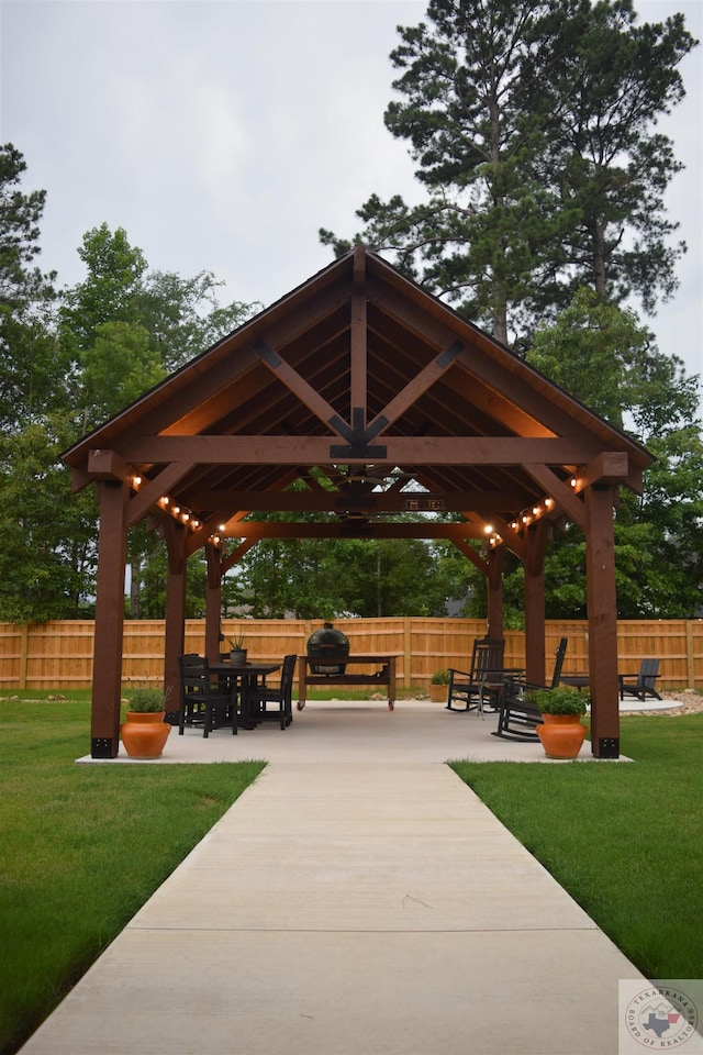 surrounding community with a gazebo, a patio, and a yard