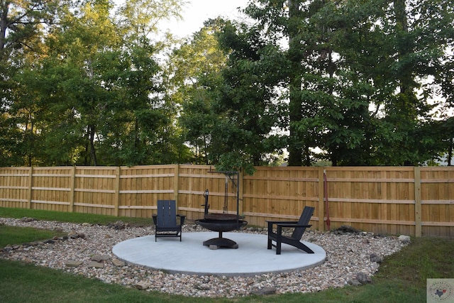 view of yard with a patio area and a fire pit