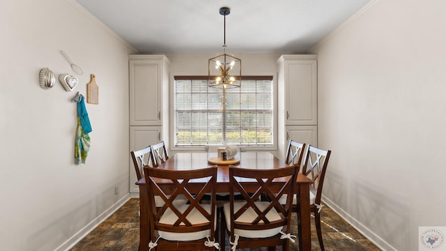 dining space featuring an inviting chandelier, ornamental molding, baseboards, and stone finish flooring