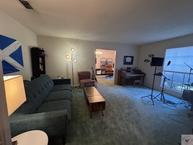 carpeted living room featuring a chandelier