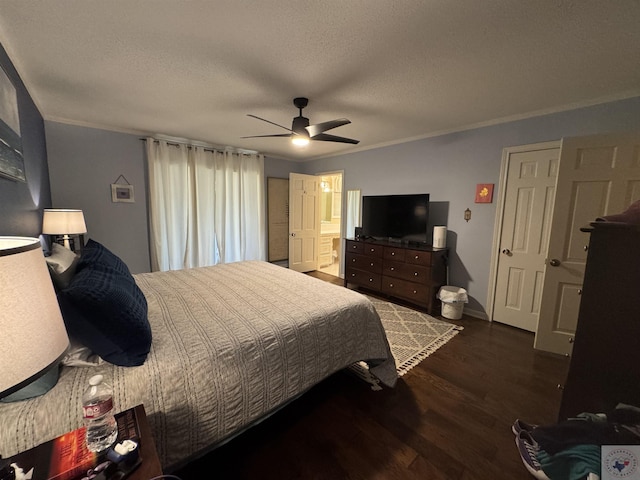 bedroom featuring crown molding, ceiling fan, dark wood-type flooring, a textured ceiling, and ensuite bath