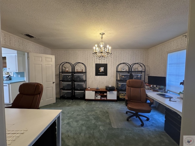 carpeted office with a textured ceiling, a notable chandelier, and ornamental molding