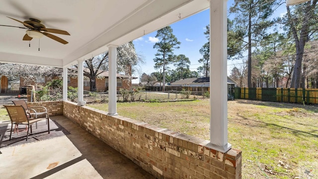 view of patio / terrace with a fenced backyard and a ceiling fan