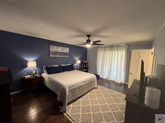 bedroom featuring a textured ceiling, dark hardwood / wood-style floors, ceiling fan, and ornamental molding