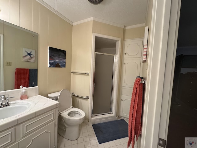 bathroom with crown molding, a shower with door, tile patterned flooring, and vanity