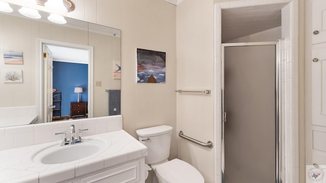 full bathroom with a shower stall, toilet, and vanity