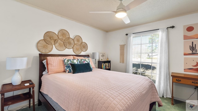 bedroom featuring carpet floors, a textured ceiling, and ceiling fan