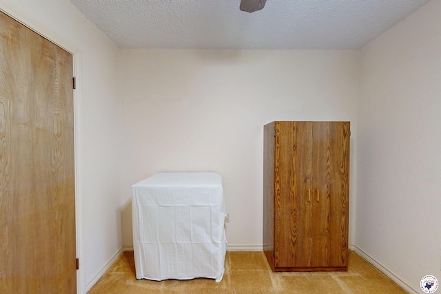 713 Franklin St, Texarkana, TX 75501 - unfurnished bedroom with light colored carpet, a textured ceiling, and baseboards