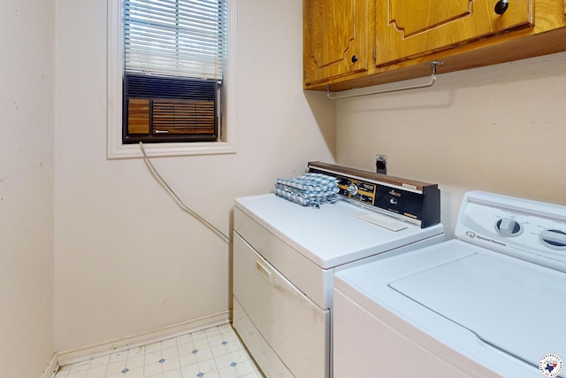 713 Franklin St, Texarkana, TX 75501 - laundry room with washing machine and clothes dryer, cabinet space, baseboards, and light floors