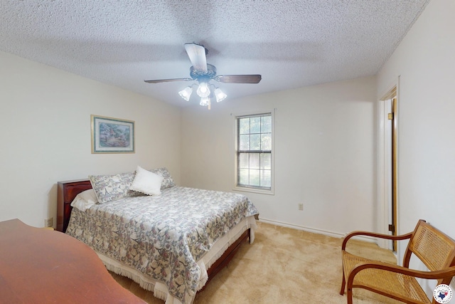 713 Franklin St, Texarkana, TX 75501 - bedroom with light colored carpet, a ceiling fan, a textured ceiling, and baseboards