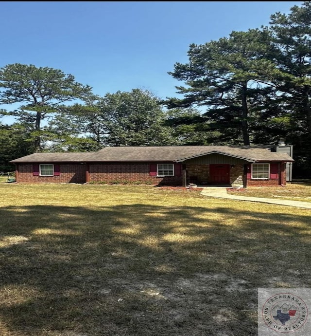 view of side of home with a lawn