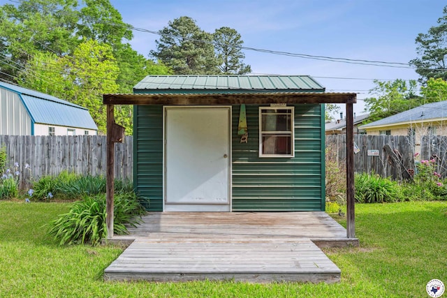 view of shed featuring fence