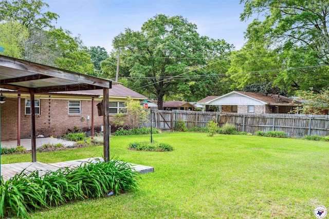 view of yard with fence and a patio area