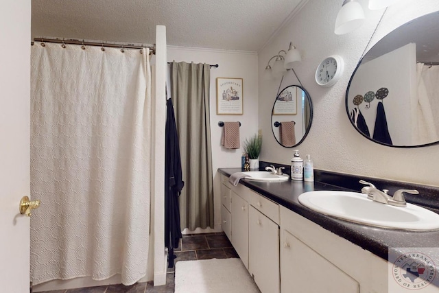 bathroom with vanity, walk in shower, crown molding, tile patterned floors, and a textured ceiling