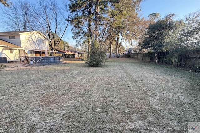 view of yard featuring a fenced in pool