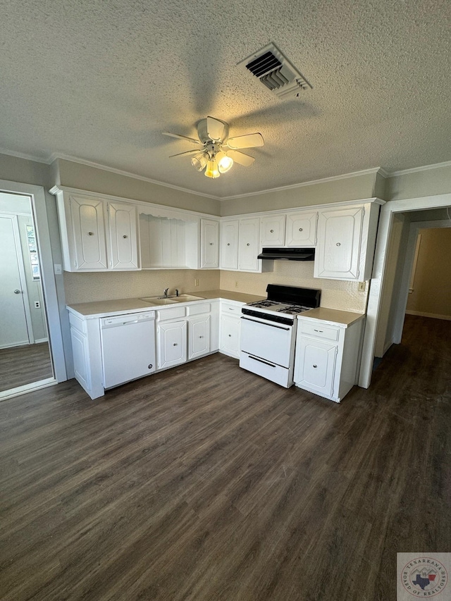 kitchen featuring white appliances, dark wood-type flooring, white cabinetry, sink, and crown molding