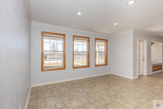 spare room featuring crown molding