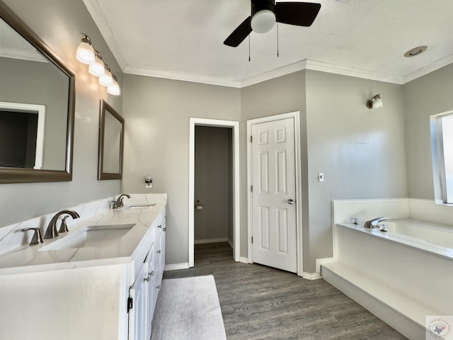 full bath with a sink, ornamental molding, ceiling fan, and wood finished floors