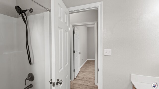 6011 Beacon Hill Dr, Texarkana, TX 75503 - bathroom with wood finished floors and baseboards