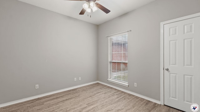 6011 Beacon Hill Dr, Texarkana, TX 75503 - unfurnished room with wood finished floors, ceiling fan, plenty of natural light, and baseboards