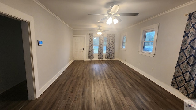 empty room featuring dark hardwood / wood-style floors, ceiling fan, and ornamental molding