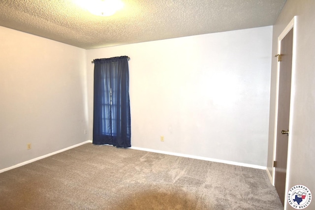 1104A E 23rd St, Texarkana, AR 71854 - carpeted spare room with a textured ceiling and baseboards