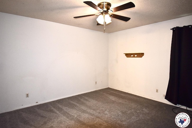 1104A E 23rd St, Texarkana, AR 71854 - spare room with dark carpet, a ceiling fan, and a textured ceiling