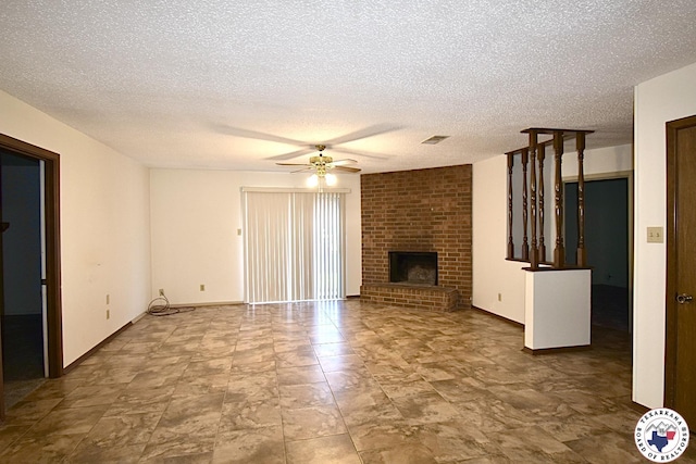 1104A E 23rd St, Texarkana, AR 71854 - unfurnished living room featuring a textured ceiling, ceiling fan, and a brick fireplace
