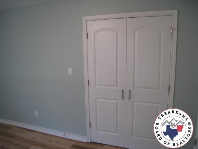 8820 W New Boston Rd, Texarkana, TX 75501 - detailed view of wood finished floors and baseboards
