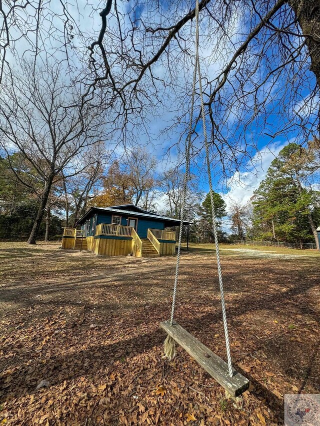 view of yard with a wooden deck