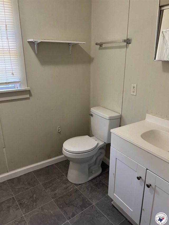 319 Crestview Rd, Texarkana, TX 75501 - bathroom with toilet, vanity, tile patterned floors, and baseboards